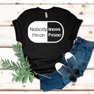 Robbie Williams Wearing Noboydy I’m On Knows Prozac Shirt