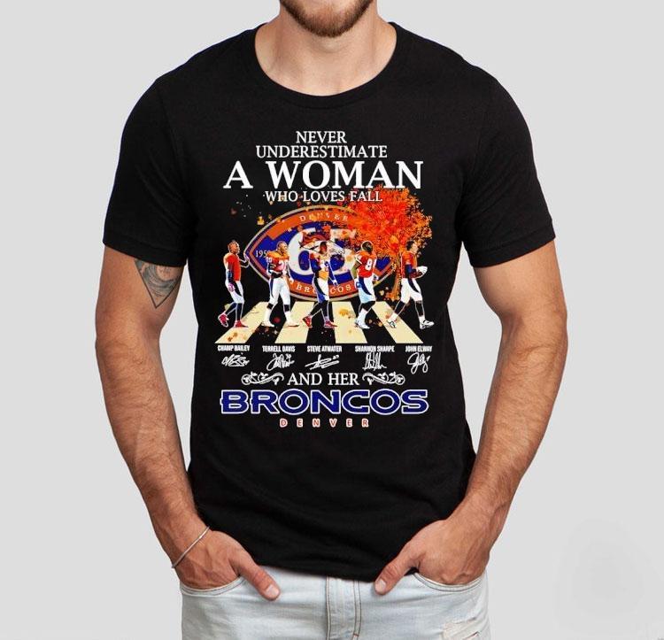 Never Underestimate A Woman Who Loves Fall And Her Denver Broncos Walking Across Signatures Shirt Never Underestimate A Woman Who Loves Fall And Her Denver Broncos Walking Across Signatures Shirt