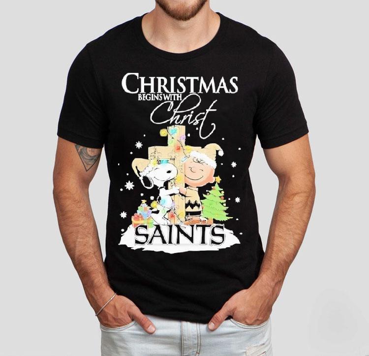 Snoopy And Charlie Brown The Peanuts X New Orleans Saints Merry Christmas Begins With Christ Shirt 4 Snoopy And Charlie Brown The Peanuts X New Orleans Saints Merry Christmas Begins With Chris Tshirt