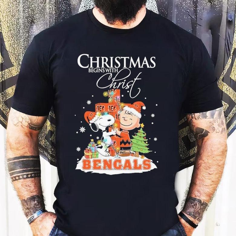 Snoopy And Charlie Brown The Peanuts X Cincinnati Bengals Merry Christmas Begins With Christ Shirt Snoopy And Charlie Brown The Peanuts X Cincinnati Bengals Merry Christmas Begins With Christ Shirt