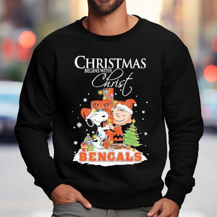 Snoopy And Charlie Brown The Peanuts X Cincinnati Bengals Merry Christmas Begins With Christ Shirt Snoopy And Charlie Brown The Peanuts X Cincinnati Bengals Merry Christmas Begins With Christ Shirt