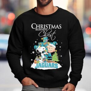 Snoopy And Charlie Brown The Peanuts X Jacksonville Jaguars Merry Christmas Begins With Chris Sweatshirt