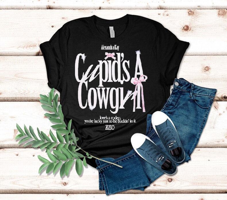 Alexandra Kay Cupid's A Cowgirl Love's A Rodeo You're Lucky Just To Be Fuckin' In It 2025 Bow Shirt 4 Alexandra Kay Cupid S A Cowgirl Love S A Rodeo You Re Lucky Just To Be Fuckin In It Bow Tshirt