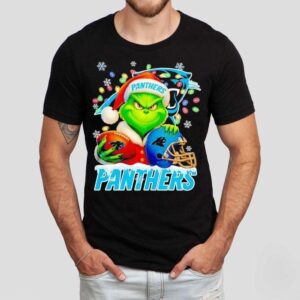 Grinch Holding Football And Helmet Carolina Panthers Merry Christmas Shirt Grinch Holding Football And Helmet Carolina Panthers Merry Christmas Shirt
