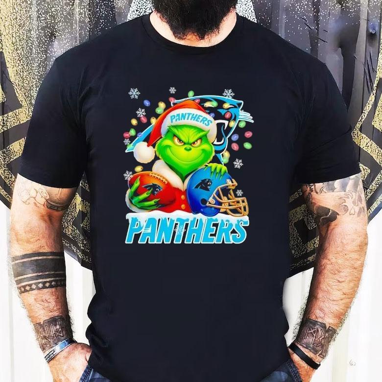 Grinch Holding Football And Helmet Carolina Panthers Merry Christmas Shirt Grinch Holding Football And Helmet Carolina Panthers Merry Christmas Shirt