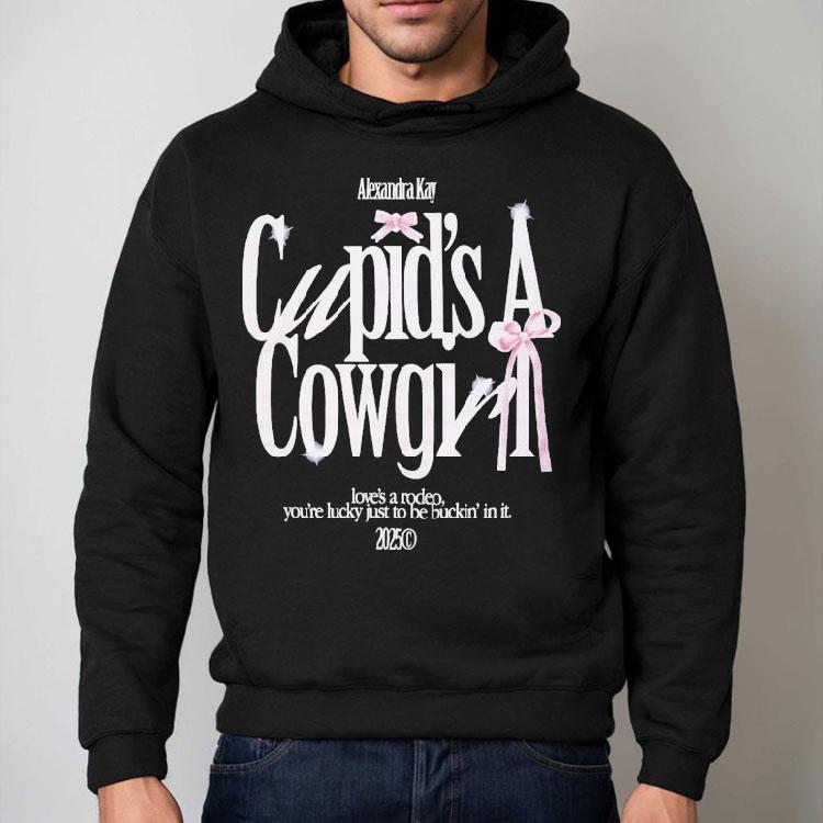 Alexandra Kay Cupid’s A Cowgirl Love’s A Rodeo You’re Lucky Just To Be Fuckin’ In It 2025 Bow Shirt Alexandra Kay Cupid’s A Cowgirl Love’s A Rodeo You’re Lucky Just To Be Fuckin’ In It 2025 Bow Shirt