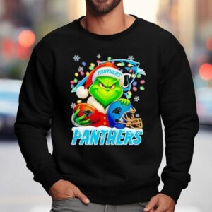 Grinch Holding Football And Helmet Carolina Panthers Merry Christmas Shirt 3 Grinch Holding Football And Helmet Carolina Panthers Merry Christmas Sweatshirt