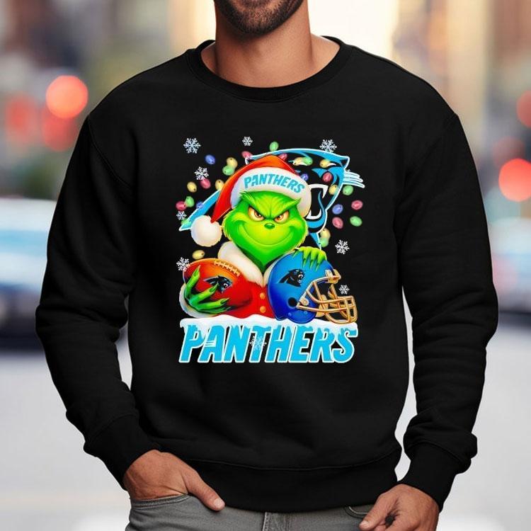 Grinch Holding Football And Helmet Carolina Panthers Merry Christmas Shirt Grinch Holding Football And Helmet Carolina Panthers Merry Christmas Shirt